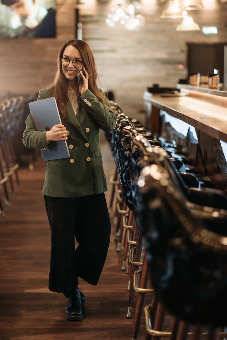 Woman Talking On The Phone While Standing 