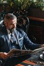 A Man Reading the Newspaper