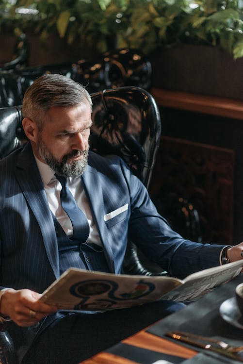 Free A Man Reading the Newspaper Stock Photo