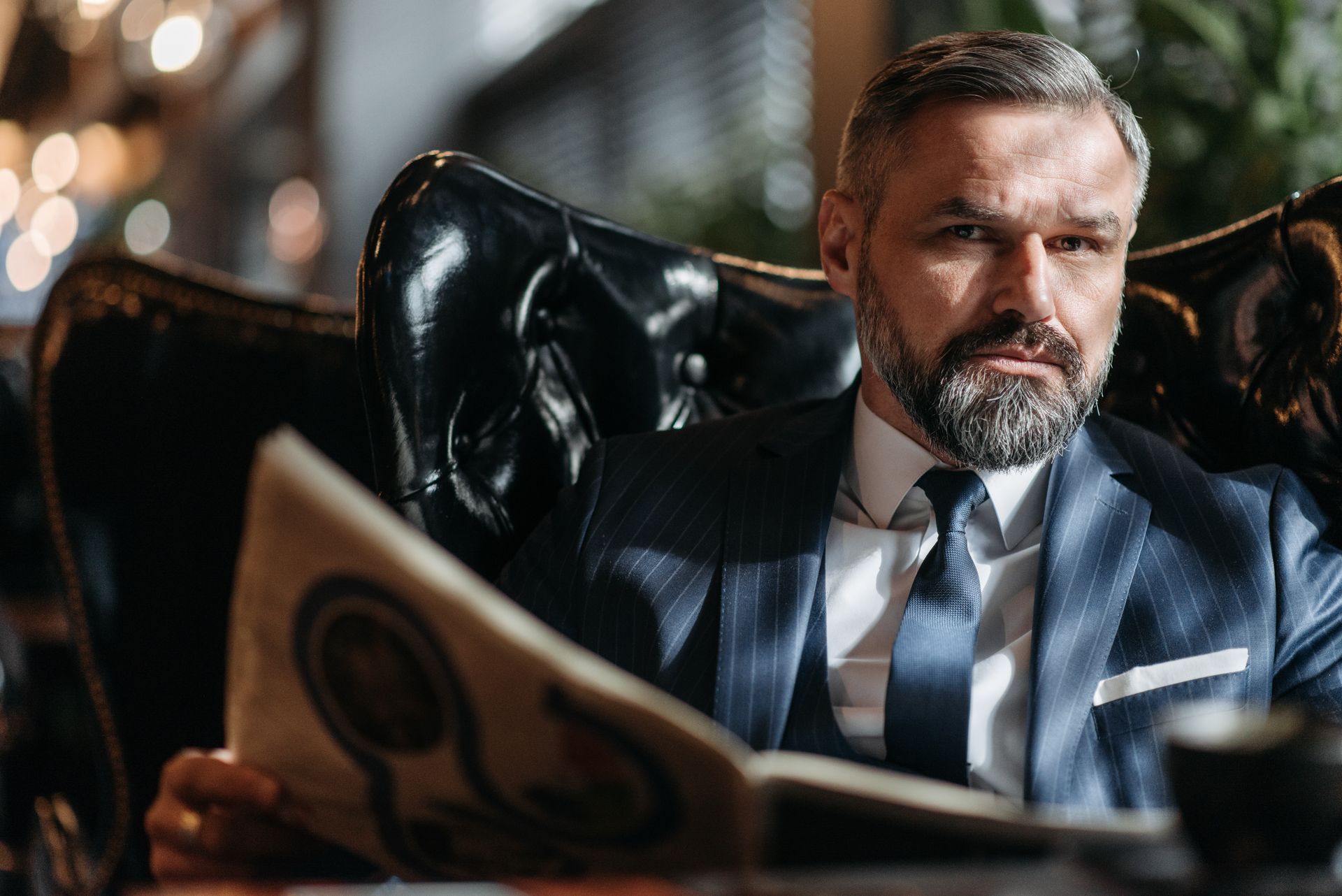 A Man Holding a Newspaper