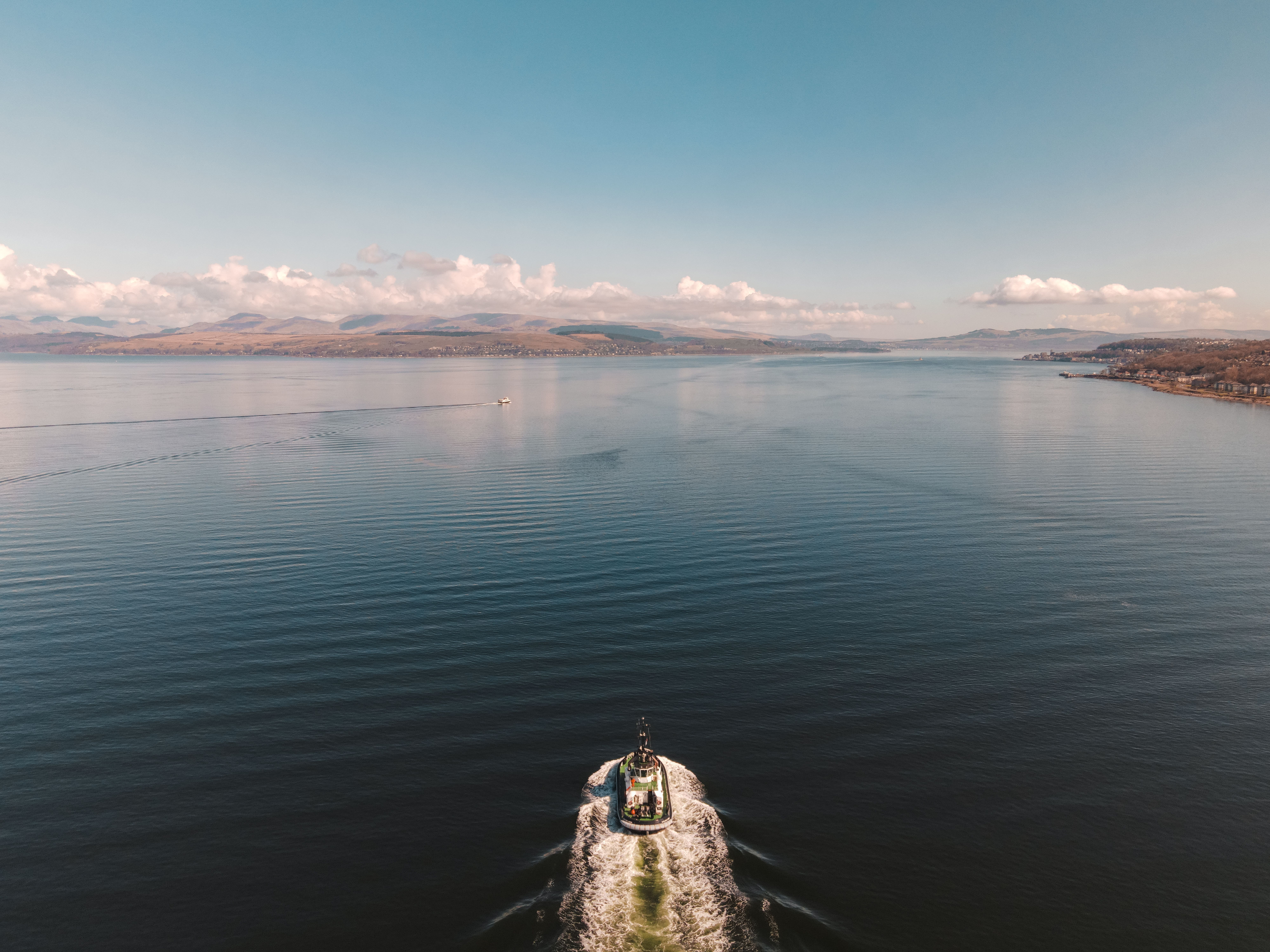 White Boat Sailing on a Wide Body of Water · Free Stock Photo
