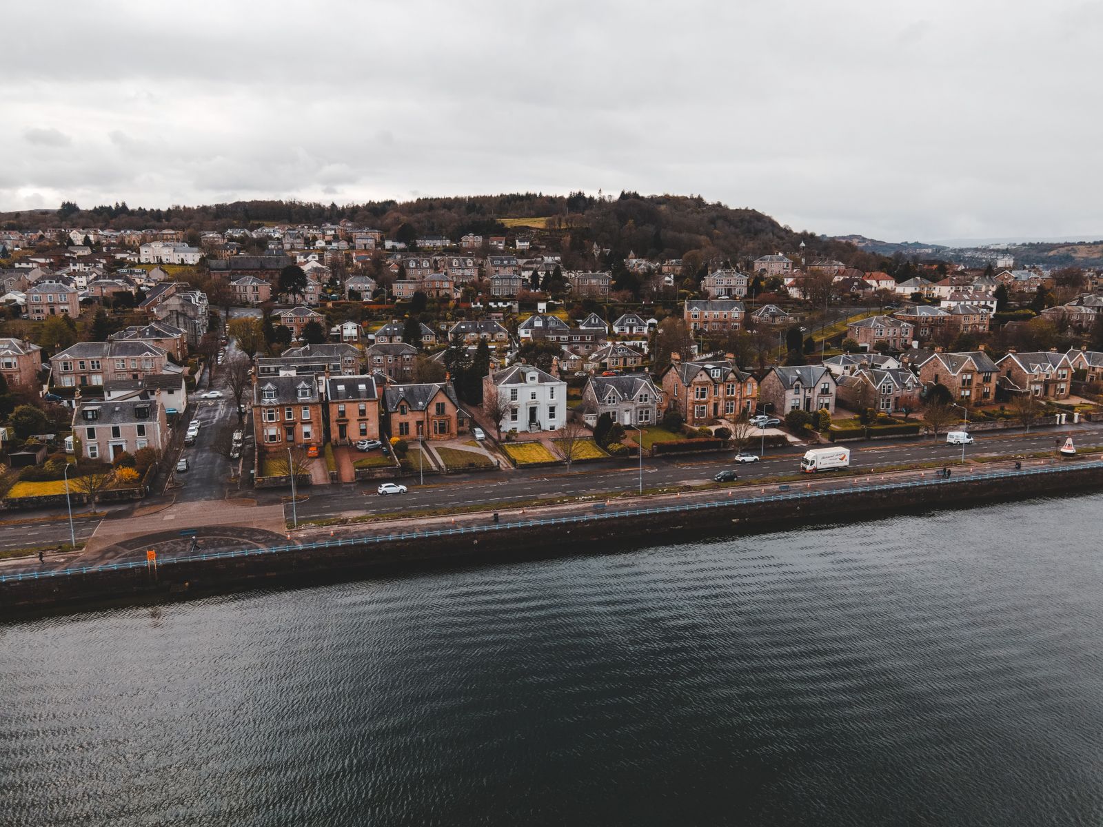 Waterfront homes in a Scottish town, representing homes we cover in and around Hawick