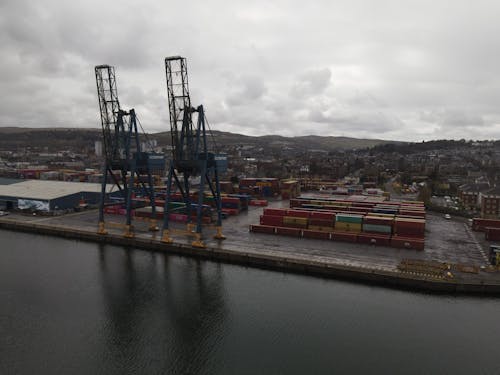 Cargo Containers on Dock Under Cloudy Sky
