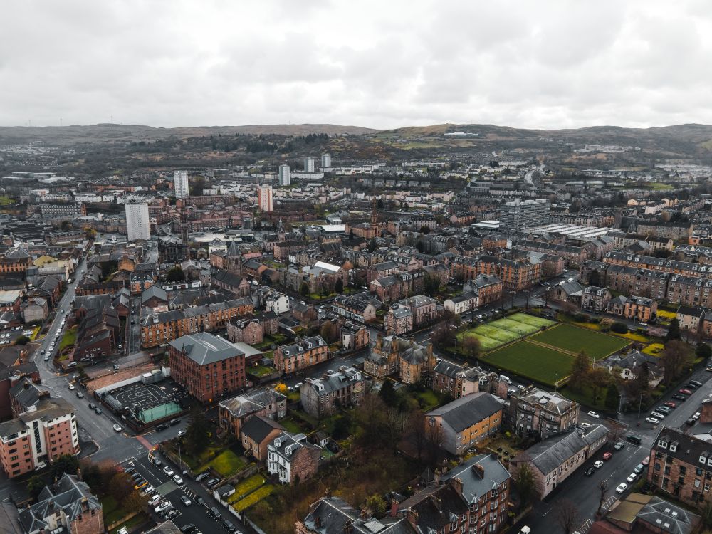 Aerial View of City Under Cloudy Sky · Free Stock Photo