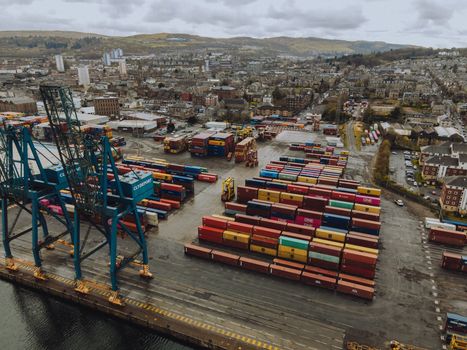 Aerial shot of Clydeport shipping containers in a busy Scottish port.