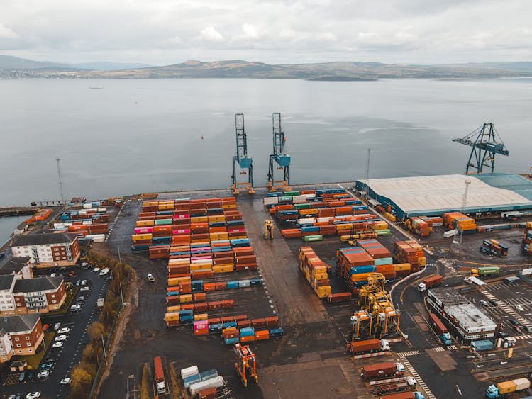 An Aerial Photography Of Cargo Containers Near The Ocean