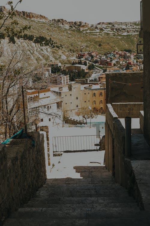 Narrow Streets Between Buildings in a Town on a Hill 