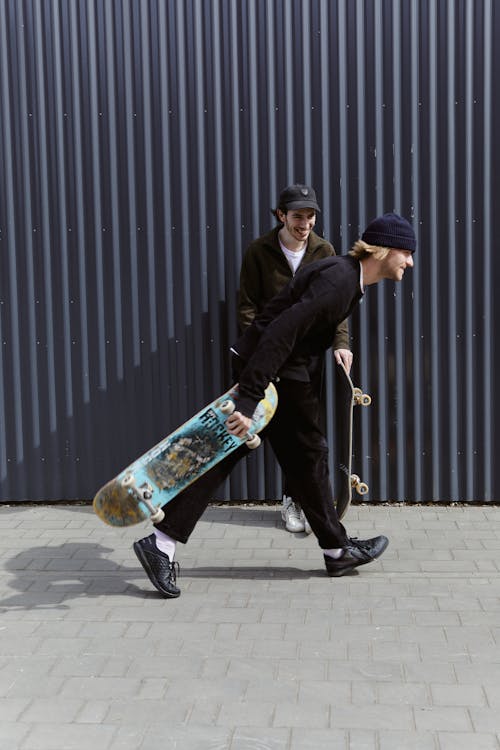 Men Having Fun with Their Skateboard