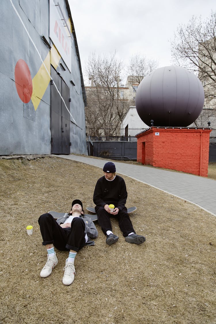 Friends Sitting Outside A Building