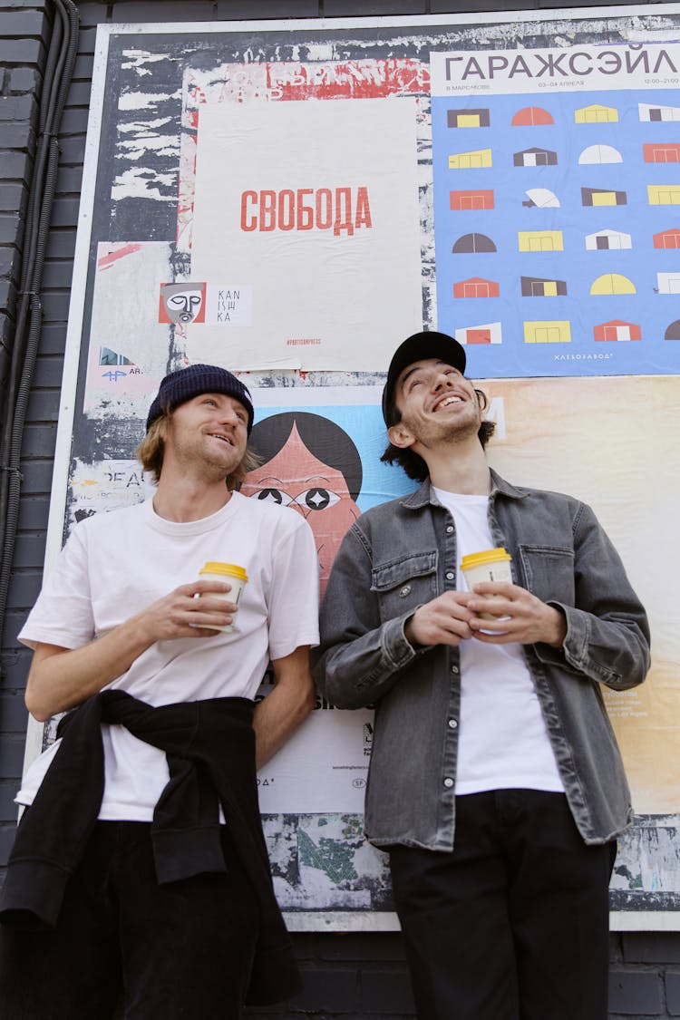 Photograph Of Men Holding Cups Of Coffee