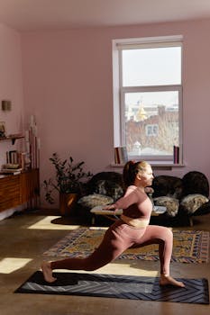 Adult woman performing yoga pose on mat in a bright, stylish living room. Promotes wellness and mindfulness.
