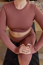 Close-up Photo of a Woman Stretching Her Legs