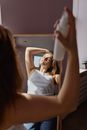 Woman in White Tank Top Holding White Ceramic Mug