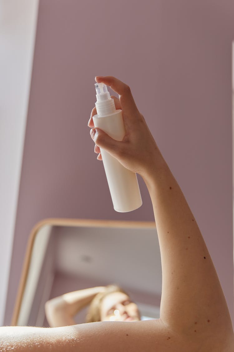 Person Holding Plastic Bottle Spray 