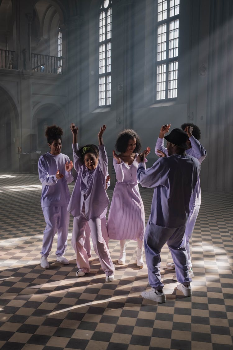 Group Of People In Lilac Uniform Doing Church Service