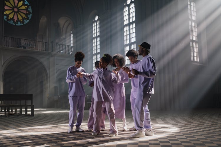 Group Of People In Lilac Uniform Doing Church Service