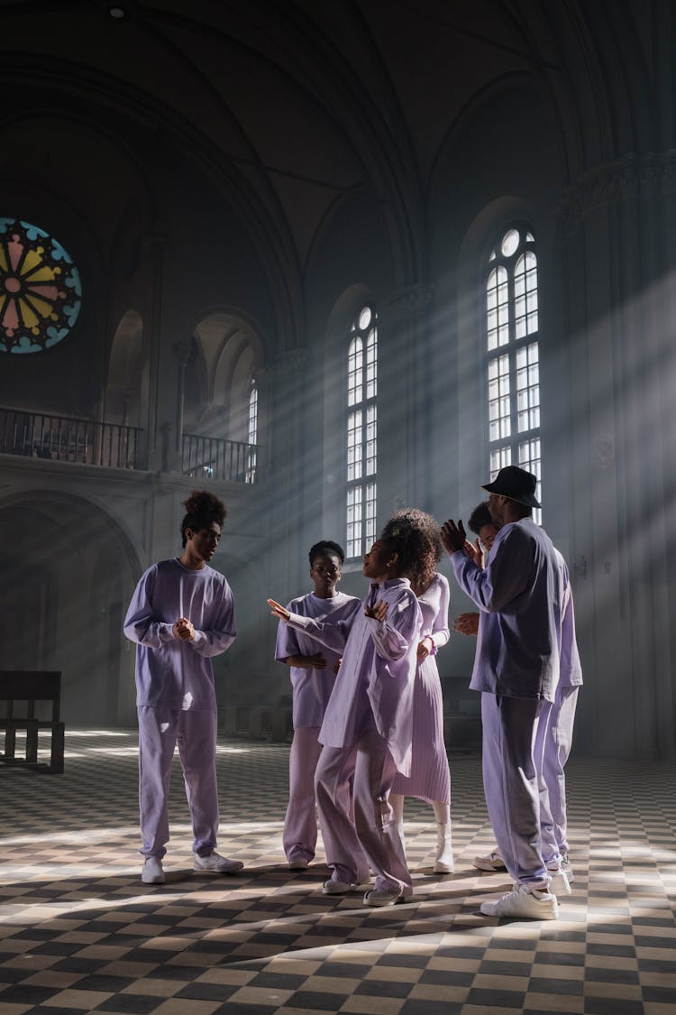 Group Of People In Lilac Uniform Doing Church Service