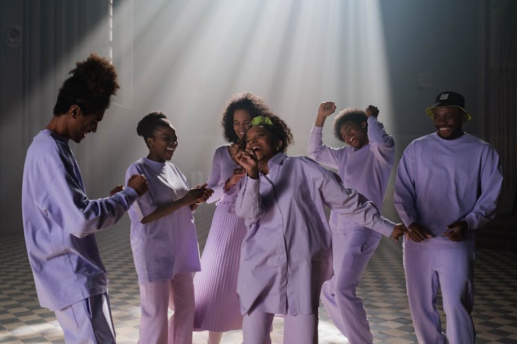 Group Of People In Lilac Uniform Doing Church Service