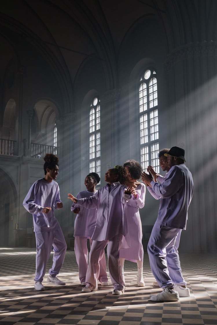 Group Of People In Lilac Uniform Doing Church Service