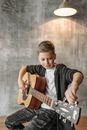 Woman in Black Tank Top Playing Brown Acoustic Guitar