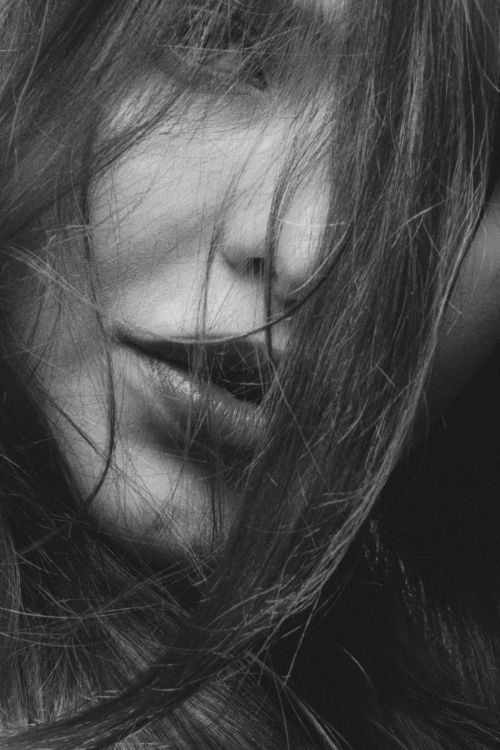 Free Expressive black and white portrait close-up capturing a mysterious aura. Stock Photo