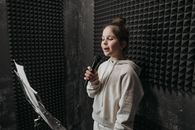 A Girl Singing inside a Soundproof Room