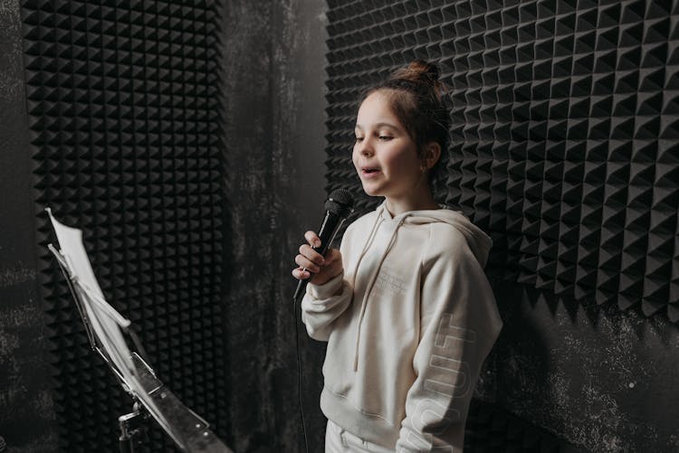 A Girl Singing Inside A Soundproof Room