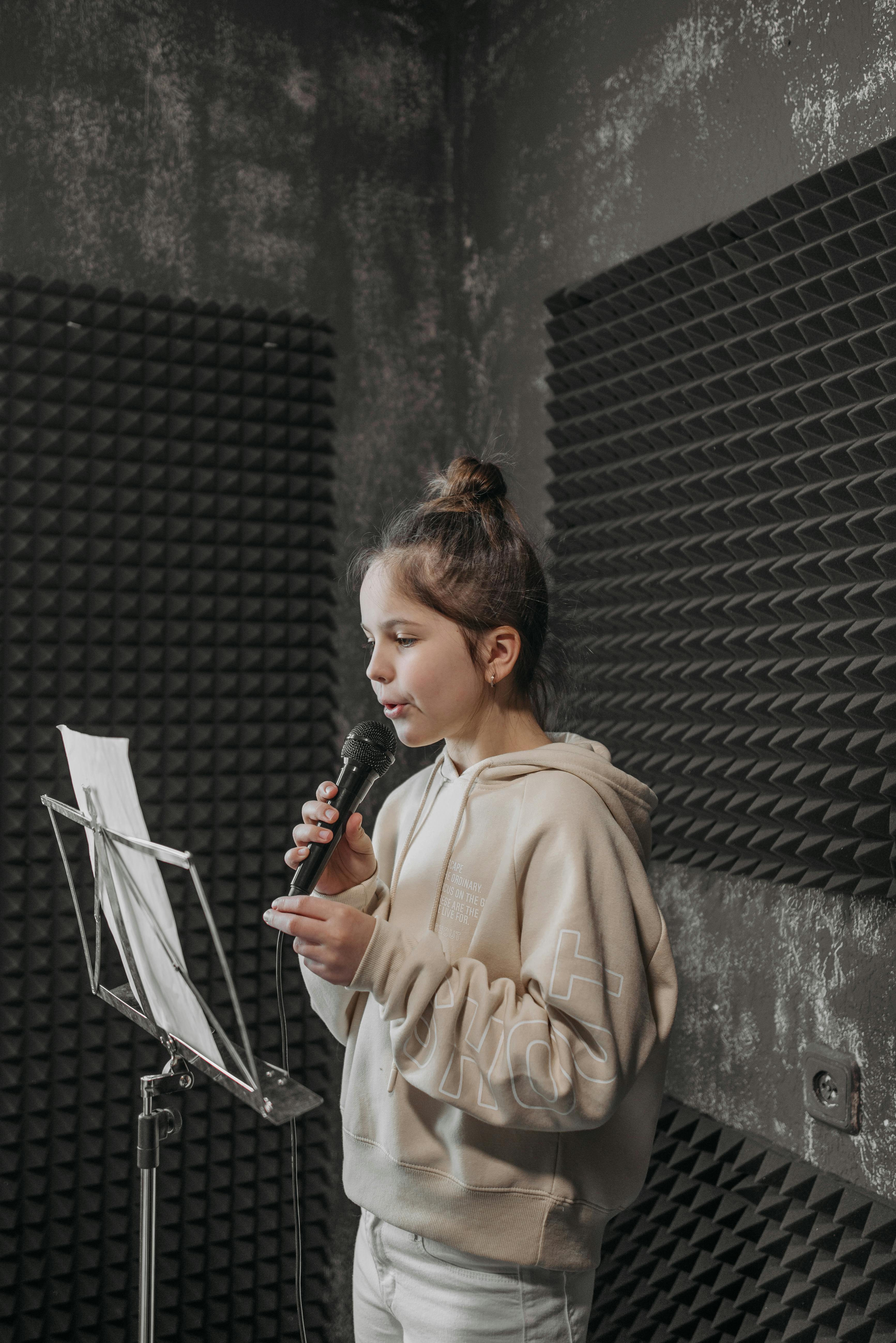 girl singing in a studio