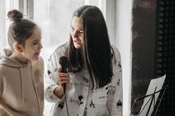 Woman and Girl Singing Together