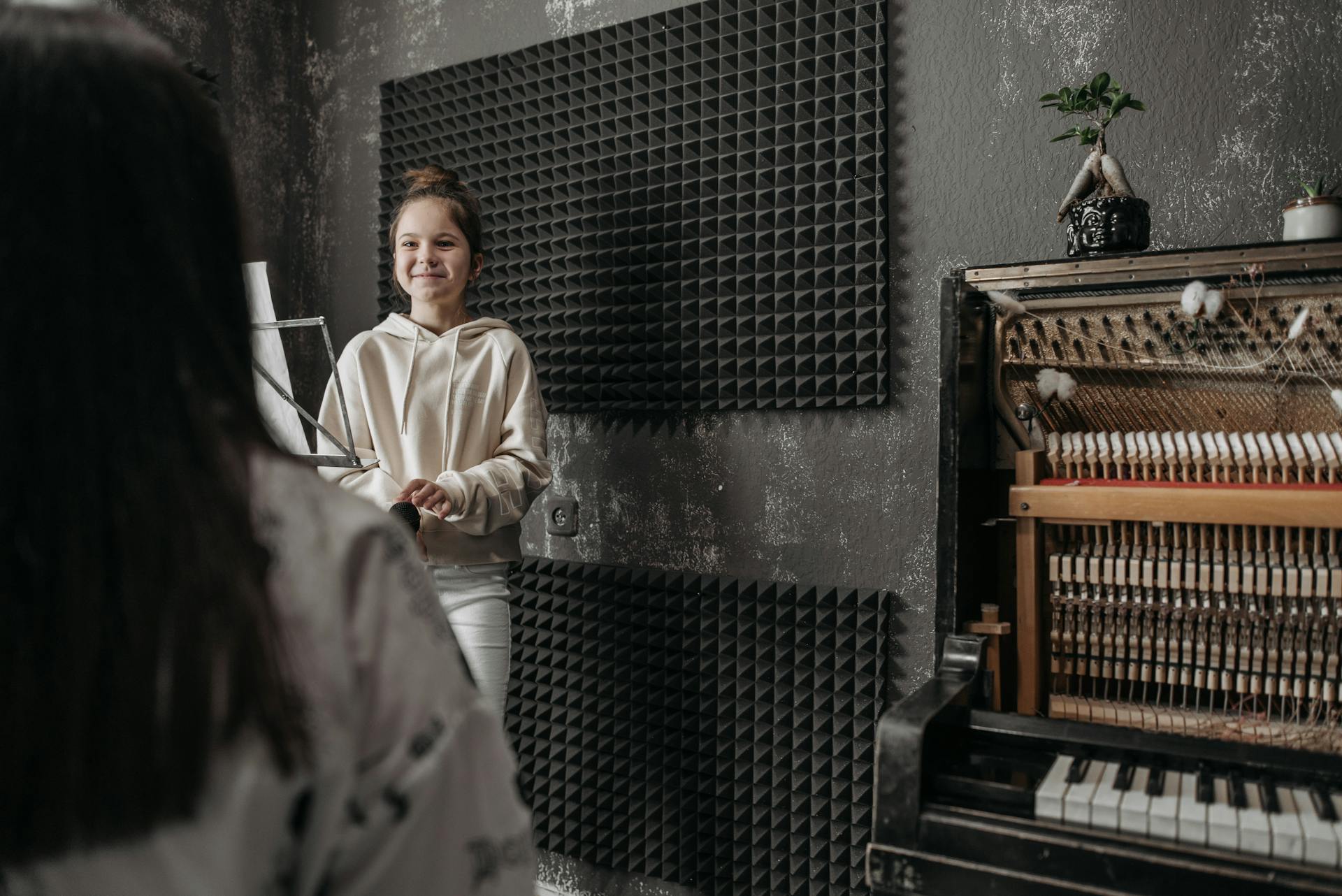 A Girl Standing in the Music Studio
