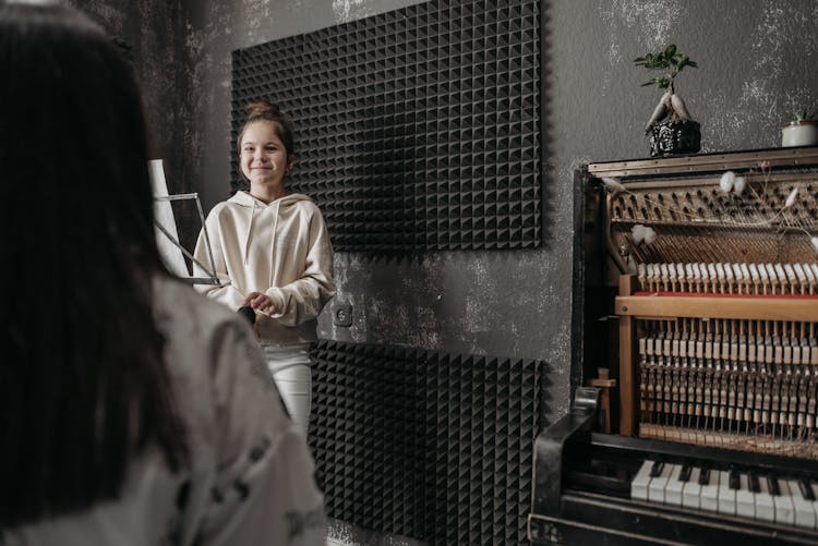 A Girl Standing In The Music Studio