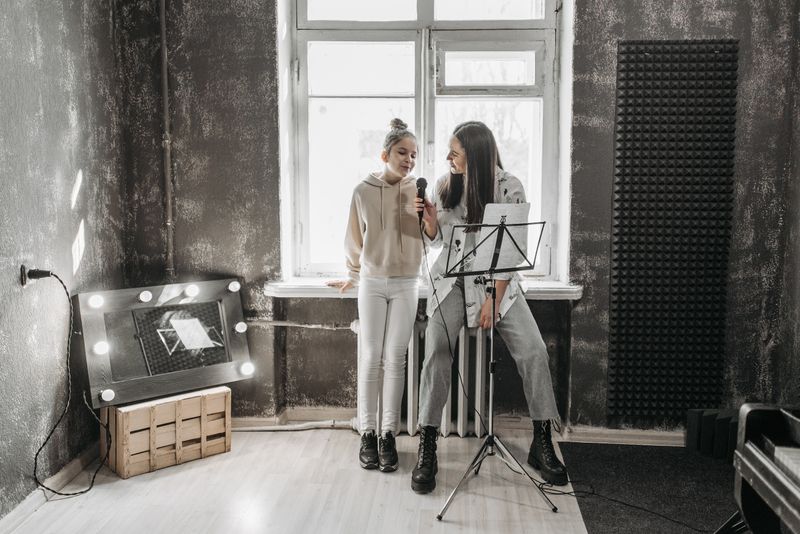 Vocal coach singing together with a student