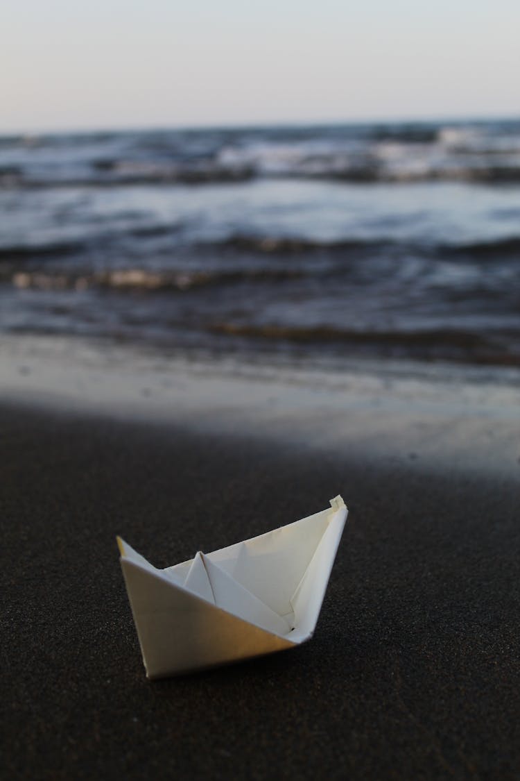 Paper Boat On Beach