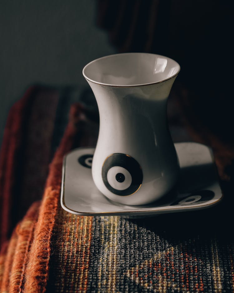 Cup Of Coffee With Saucer On Carpet