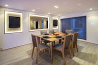 A Brown Wooden Table With Chairs