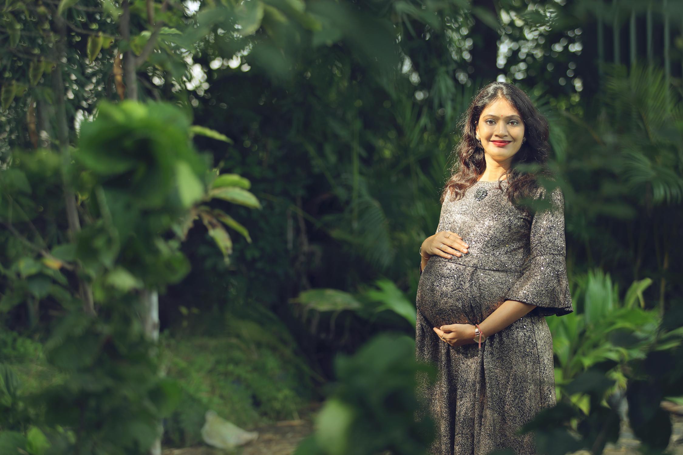Pregnant Indian Photo by Ashwin Shrigiri from Pexels: https://www.pexels.com/photo/pregnant-woman-holding-her-baby-bump-while-looking-at-the-camera-7522678/