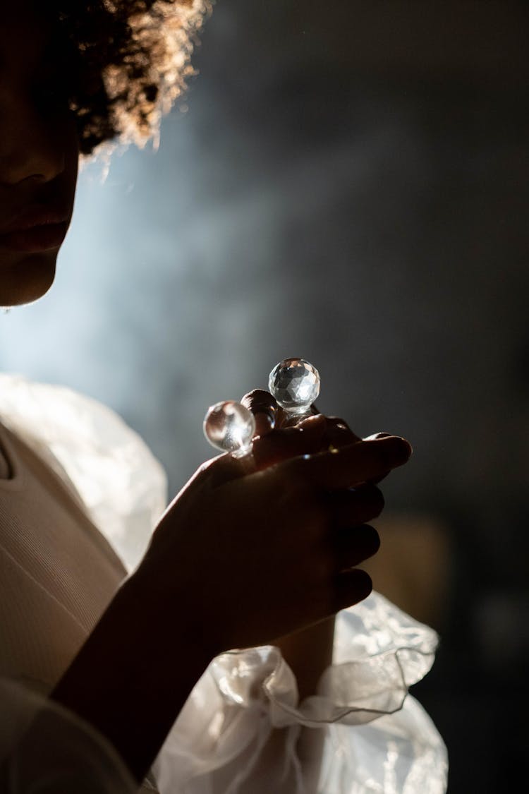 Person Holding Transparent Necklace