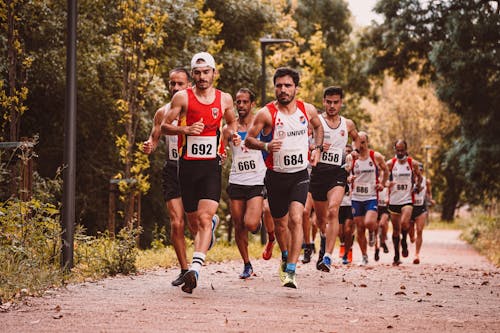 Photo of Men Running a Marathon Race