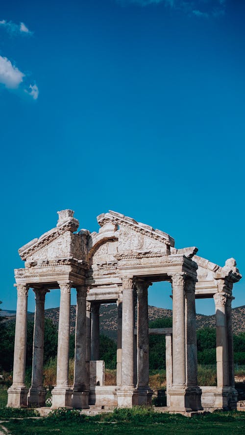 Free Ancient temple with columns under blue sky in city Stock Photo