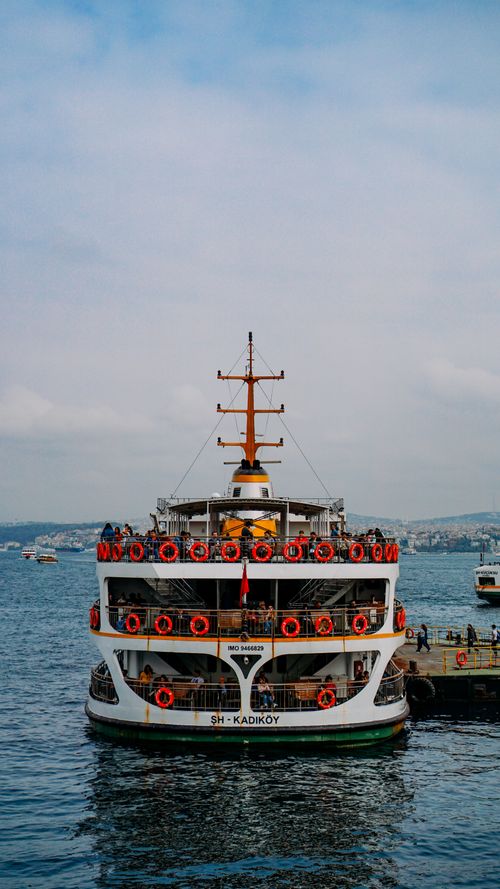 Free Ferryboat on Bosphorus strait with rippled water under cloudy sky in harbor of Istanbul Turkey Stock Photo