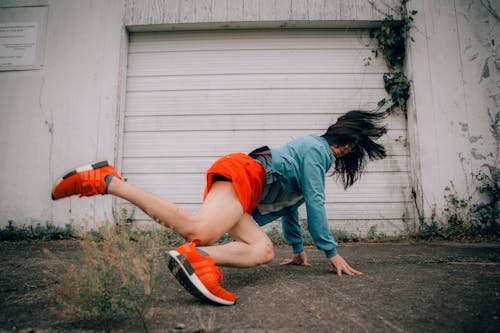 Free A Woman Dancing on the Street Stock Photo