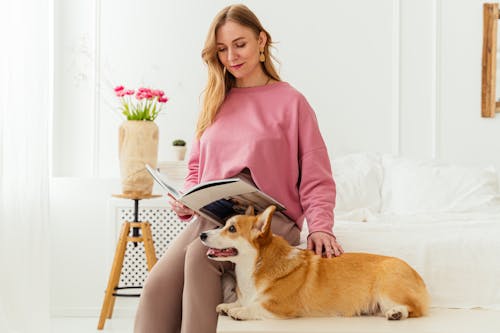 Cute Dog Lying Beside a Woman