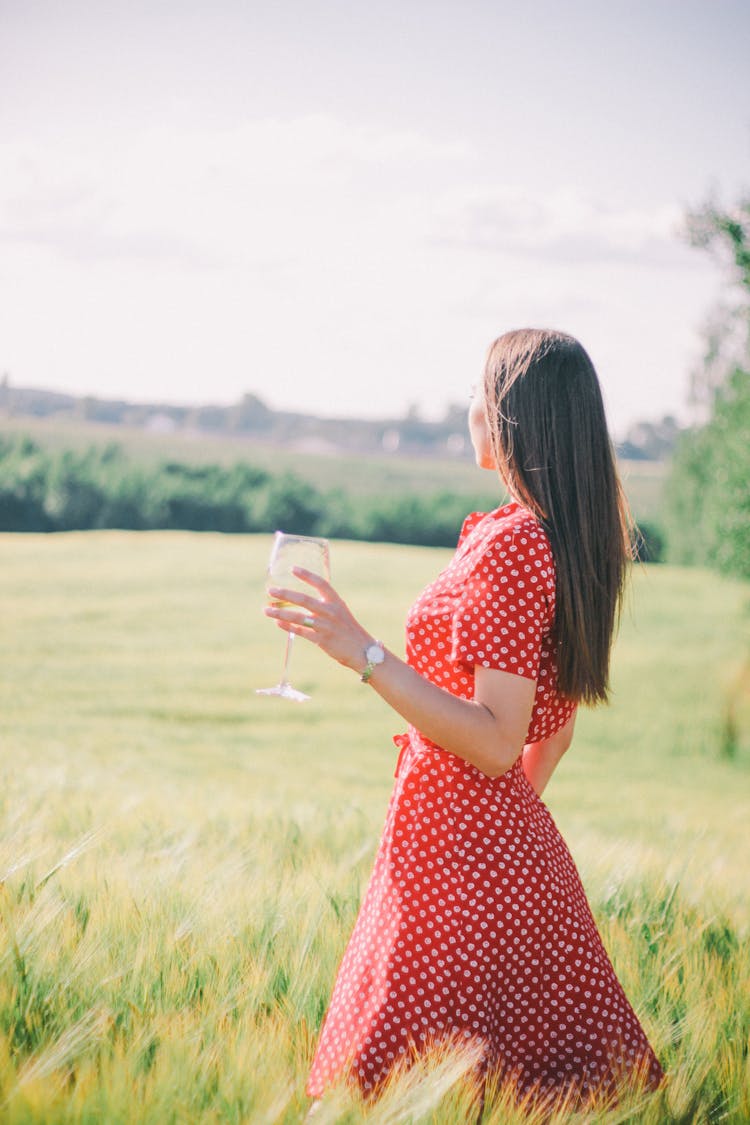 A Woman Wearing A Red Polka Dot Dress