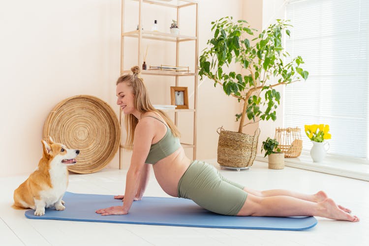 A Woman Exercising With Her Dog