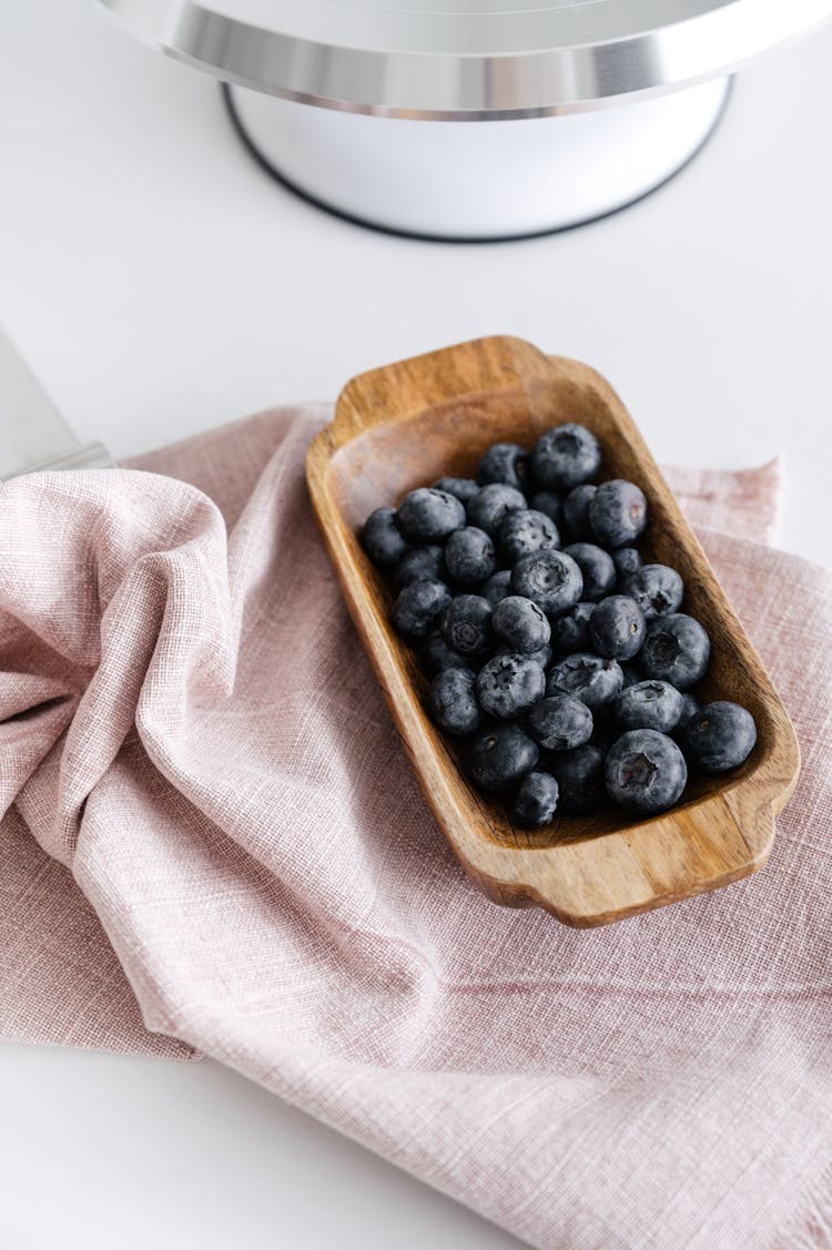 Bowl With Ripe Berries On Table