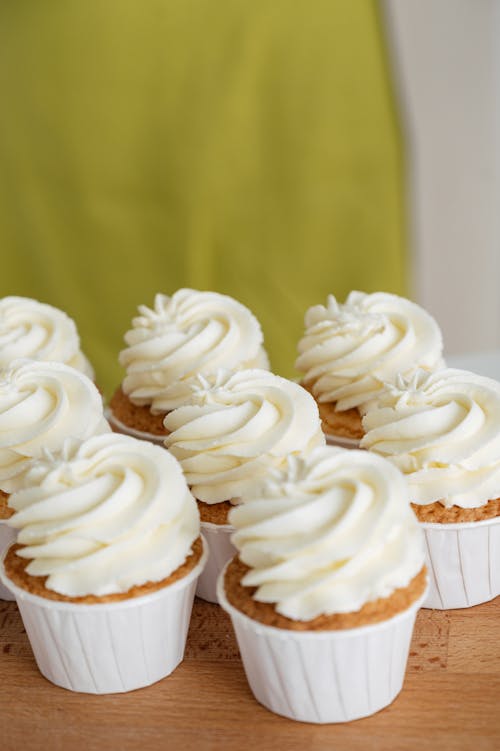 Free Close-Up Shot of Cupcakes on a Wooden Table Stock Photo