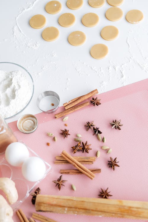 Free Fresh dough for cookies and ingredients placed on white table Stock Photo