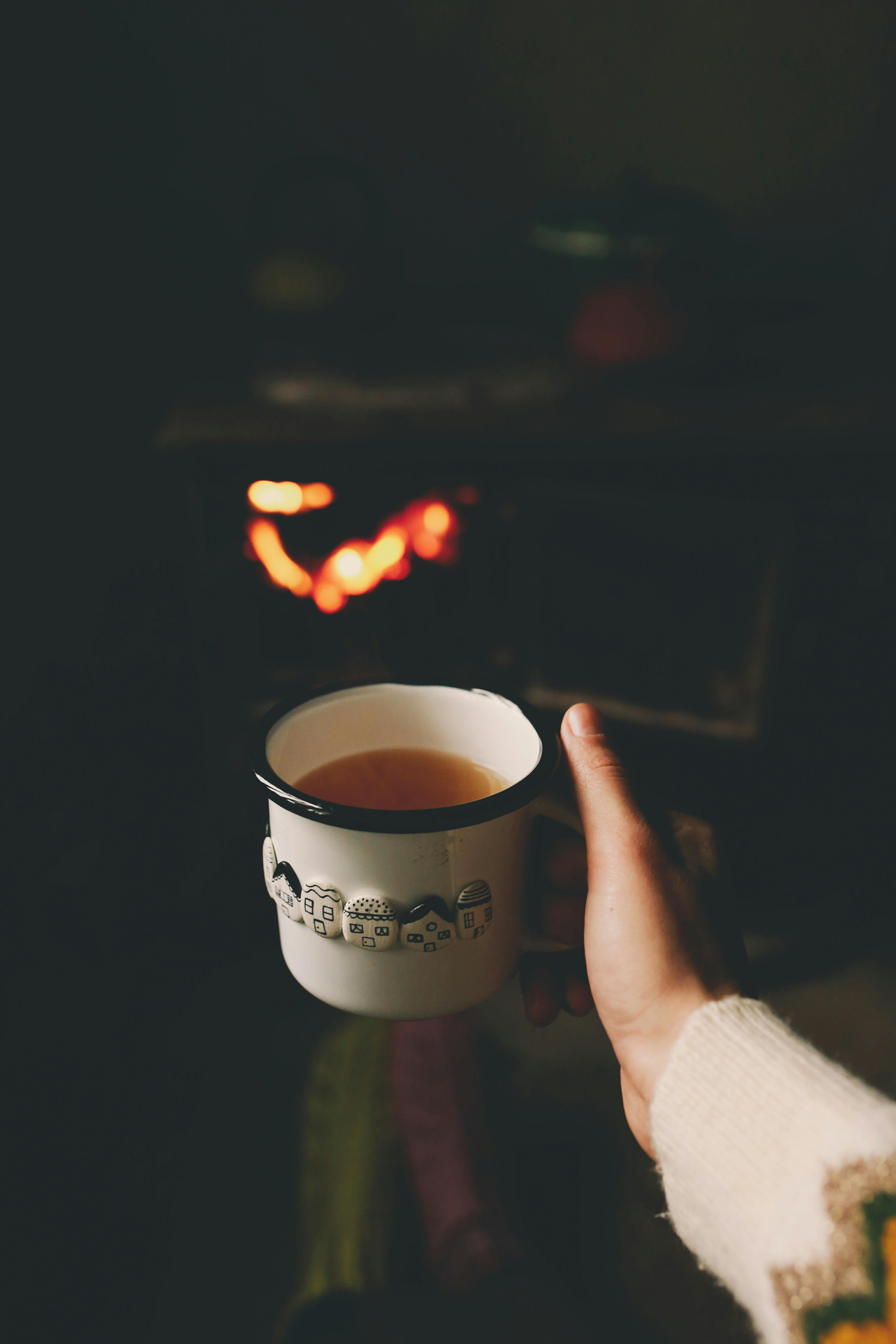 hand holding tea cup