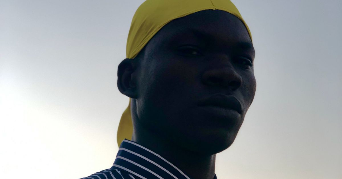 Portrait of a Man with a Yellow Durag · Free Stock Photo