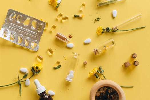 Herbal supplements and medicine capsules on a vibrant yellow background for health themes.